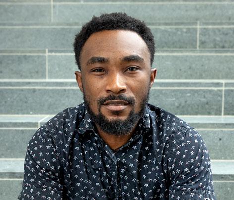 headshot of man with short sleeve shirt